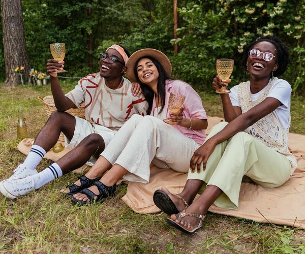 A group of diverse people enjoying a light cardio workout outdoors.